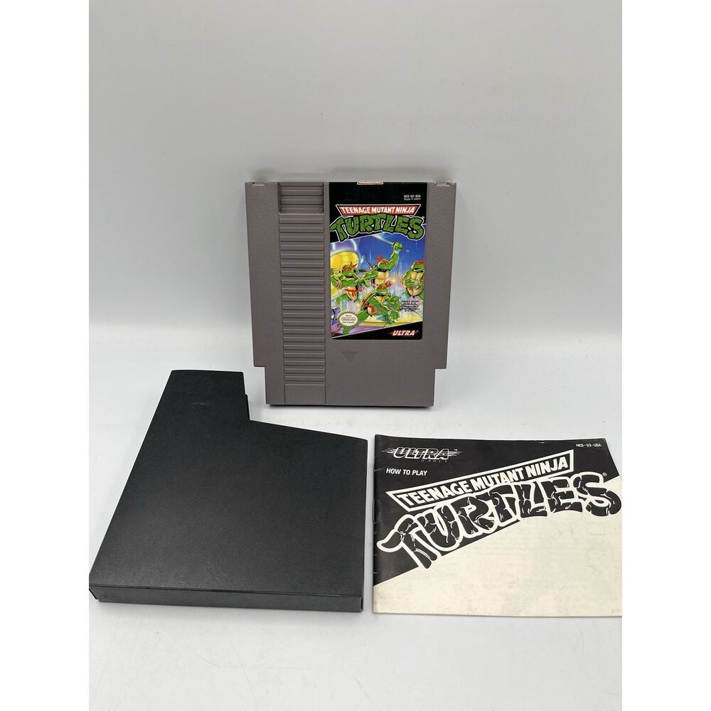 Nintendo NES Teenage Mutant Ninja Turtles Cart With Manual And Dust Cover
